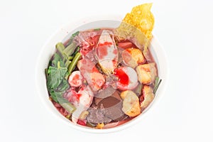 Top view yentafo rice noodles pink soup in bowl isolated