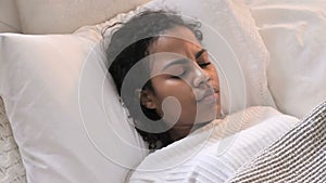 Top View of Young African Woman Waking up in Bed