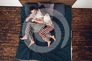 Top view. Young couple is sleeping at home. Home leisure. Couple`s sleep concept. Rest at home.