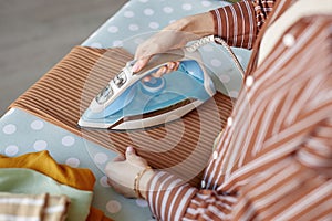 Top View Young Woman Ironing Clothes