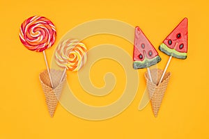 top view of yummy lollipops in waffle cones