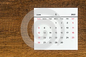 Top views Calendar desk June is the month for organizers to plan and remind on the wooden table background