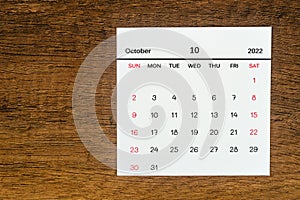 Top views Calendar desk October is the month for organizers to plan and remind on the wooden table background