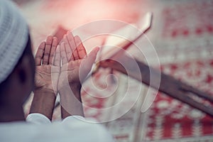 Top viewv of African Muslim Man Making Traditional Prayer To God While Wearing A Traditional Cap Dishdasha