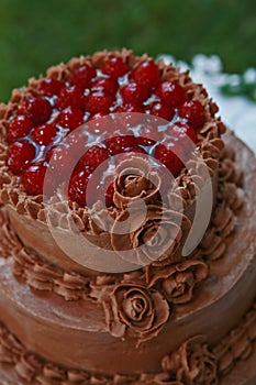 Top of wedding cake filled with cherries