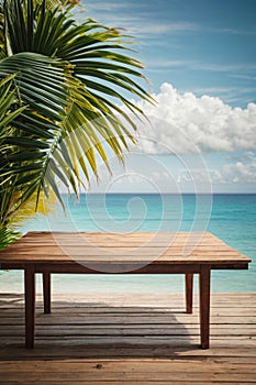 Top of wood table with seascape and palm leaves, blur bokeh light of calm sea and sky at tropical beach background. Empty ready fo