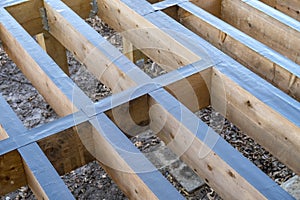 Top of a Wooden Deck Covered with Joist OR Flashing Tapes