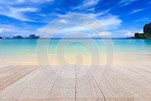 Top wooden table and blur of tropical beach background