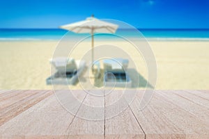 Top wooden table and blur of tropical beach background