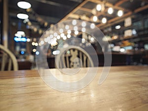 Top of wooden table with Blurred Bar restaurant background