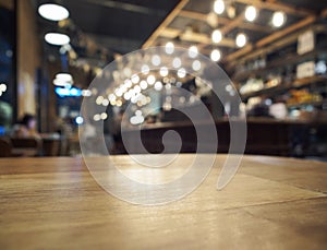 Top of Wooden table with Blurred Bar restaurant background