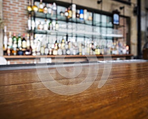 Top of wooden table counter with blurred bar Background photo