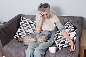 The topic is very old person and health problems. A senior Caucasian woman, 90 years old, with wrinkles and gray hair