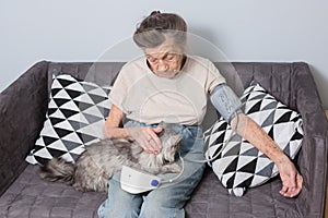 The topic is very old person and health problems. A senior Caucasian woman, 90 years old, with wrinkles and gray hair