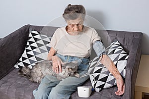 The topic is very old person and health problems. A senior Caucasian woman, 90 years old, with wrinkles and gray hair