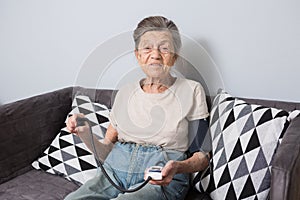 The topic is very old person and health problems. A senior Caucasian woman, 90 years old, with wrinkles and gray hair photo