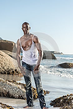 Topless african black tearing white shirt