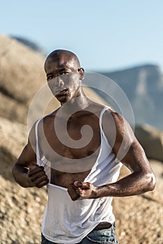 Topless african black tearing white shirt