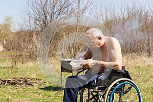 Topless Disabled Old Man Eating at the Park Alone