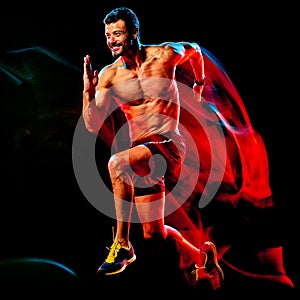 Topless muscular man runner. running jogger jogging isolated black background