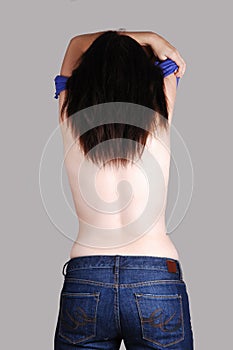 Topless woman in jeans.