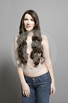 Topless Woman In Jeans With Long Brown Wavy Hair