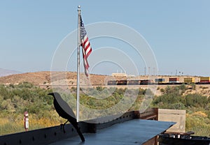 Topock, Arizona, USA flag, a Cowbird and a train