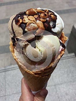 Topping with ice cream on crispy cone