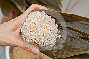 Topping up a finished dumpling with rice