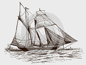 Topsail schooner yacht on wavy sea