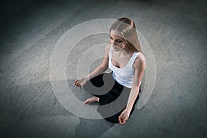 Topshot Young girl sitting and meditating