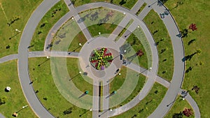 Topview Aerial shot of two little boys riding bicycles in a park