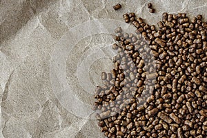 Topview of buckwheat tea in granules, on a sheet of kraft paper. close-up photo with negative space