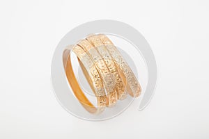 Topview of encrusted golden bracelets