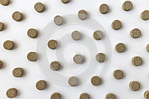 Topview of multivitamin biologically active supplements on white background. mental wellbeing and personal health concept