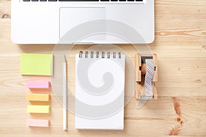 Topview of office stuff on wooden working table