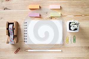 Topview of office stuff on wooden working table.