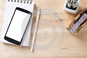 Topview of office stuff on wooden working table.