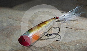 Topwater fishing lure with two treble hooks