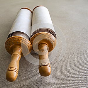 Torah scroll printed on parchment on a background of grey canvas.