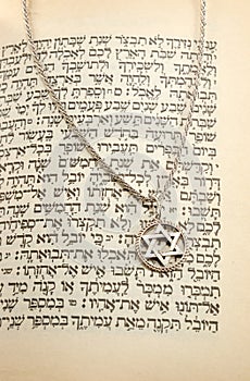 The Torah and silver chain with magen david photo
