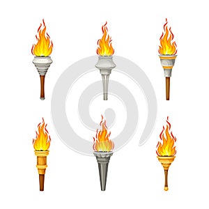 Torch with Brightly Burning Fire on Top as Ignited Light Source Vector Set