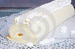 Torched merengue biscuit cake roll with exotic marmalade