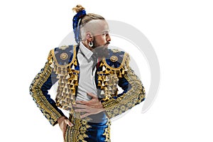 Torero in blue and gold suit or typical spanish bullfighter isolated over white
