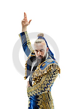 Torero in blue and gold suit or typical spanish bullfighter isolated over white