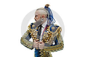 Torero in blue and gold suit or typical spanish bullfighter isolated over white photo
