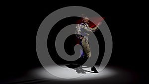 Torero in blue and gold suit or typical spanish bullfighter isolated spotlight on a black background. Close up, slow