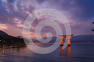 Torii Gate of Itsukushima Shrine on sunset time at Miyajima, Japan
