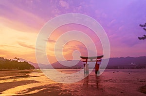 Torii Gate of Itsukushima Shrine on sunset time at Miyajima, Japan