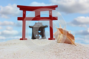 Torii Gate and Temple on Beach With Blue Sky